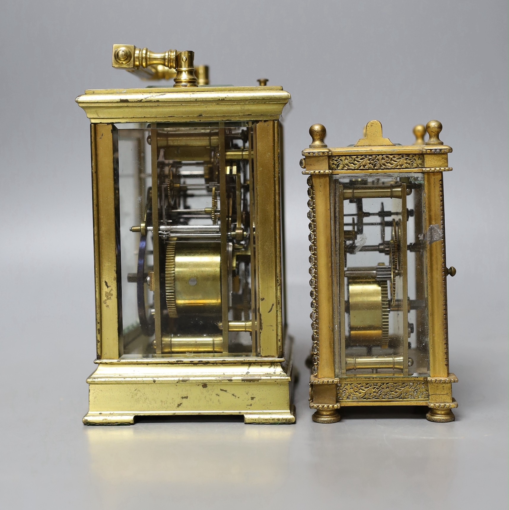 A large French repeating carriage clock with alarm, 16cm. High with handle down and a carriage timepiece